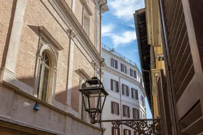 a street light on the side of a building at Piazza Navona Lovely Apartment in Rome