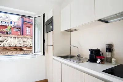 a small kitchen with a sink and a window at Ciao Bella Stella in Rome