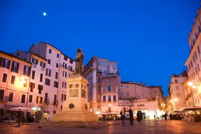 a statue in front of a building at night at Ciao Bella Stella in Rome