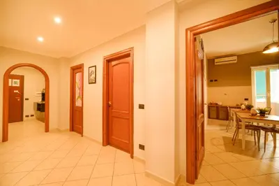 a hallway with a dining room and a kitchen at Midnight in Vatican in Rome