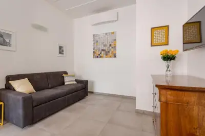a living room with a couch and a table at Franca's Home in Rome