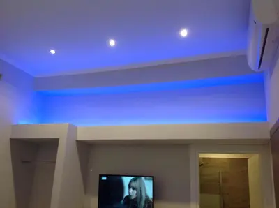 a tv in a room with a blue ceiling at Roma Veneto Relais in Rome
