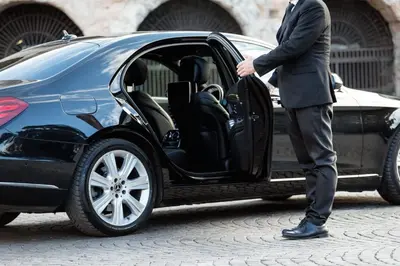 a man in a suit getting into a car at My Trevi Charming & Luxury Rooms in Rome