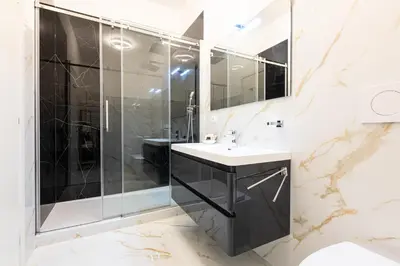 a bathroom with a shower and a sink at Il Monastero Collection in Rome