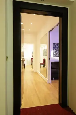 a room with a door leading to a bedroom at Sant'Angelo Exclusive Spacious Art in Rome