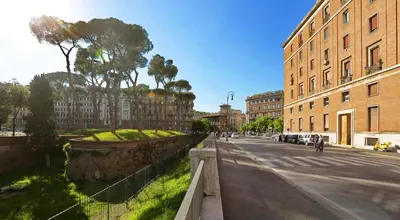 a street in a city with buildings and a fence at Sant'Angelo Exclusive Spacious Art in Rome