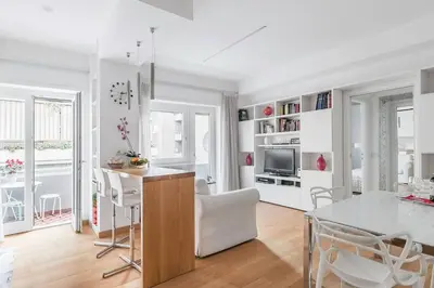 a kitchen and dining room with a table and chairs at Residenza San Pio V in Rome