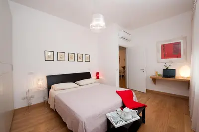 a bathroom with a washing machine and a toilet at Residenza San Pio V in Rome