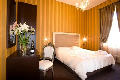 a bedroom with a bed and a table and a chair at AS Planet in Rome