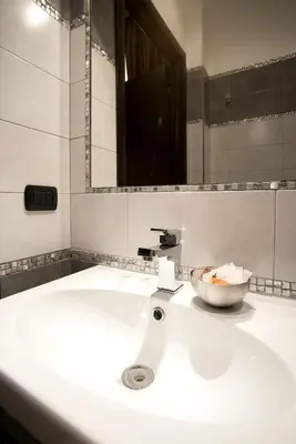 a bathroom with a sink with a bowl on it at AS Planet in Rome