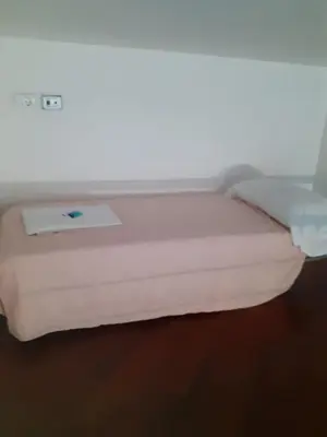 a bed with a light on top of it at Happy Rome in Rome