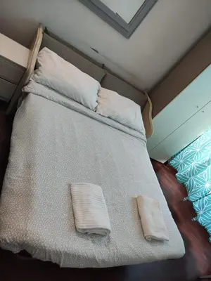 a bed with two pillows on it in a room at Happy Rome in Rome