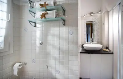 a bathroom with a sink and a mirror at River View Apartment in Rome