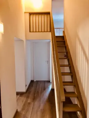 a staircase leading up to a room with a door at Heart of Rome Vatican Deluxe New Apartment 1GB WiFi in Rome