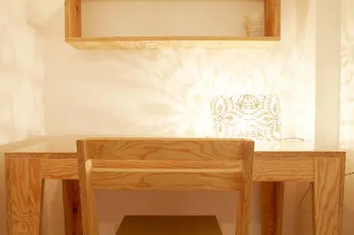 a wooden desk with a chair in a room at Testaccio Old Rome Apartment in Rome