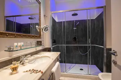 a bathroom with a shower and a sink at Hotel Monte Cenci in Rome