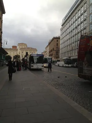 a group of buses parked on a city street at Hotel Stromboli in Rome