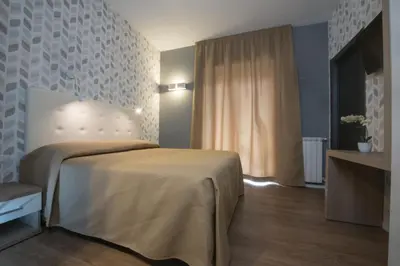 a bedroom with a bed in a room with a window at B&B Fantasie Romane in Rome