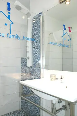 a bathroom with a sink and a shower with a mirror at Like Family House in Rome