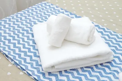 a pile of towels sitting on top of a table at Holiday rental San Lorenzo district in Rome