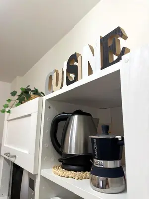a coffee pot sitting inside of a microwave oven at Casa Blaserna nel Cuore dello Shopping a Marconi e Trastevere in Rome