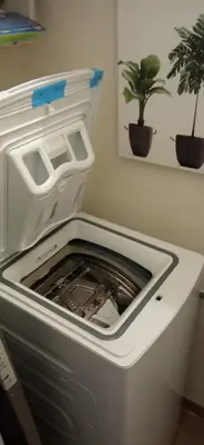 a refrigerator with its door open in a room with a plant at Casa Blaserna nel Cuore dello Shopping a Marconi e Trastevere in Rome