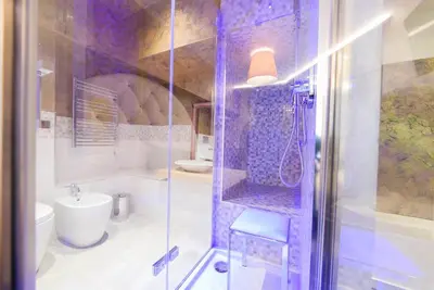 a bathroom with a shower and a toilet and a sink at Hotel Vespasiano in Rome