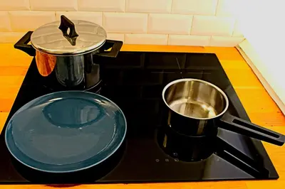 a stove top with a pot on top of it at RoRo Roma in Rome