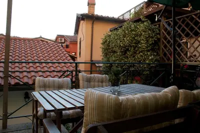 a table and chairs sitting on a balcony at Le Scalette in Rome