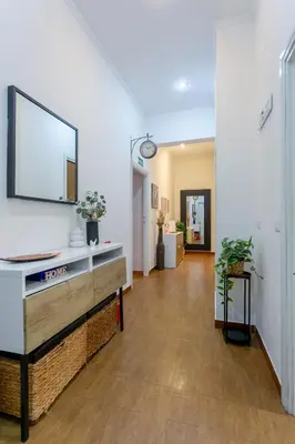 a bedroom with two beds and a desk in it at Florje House in Rome