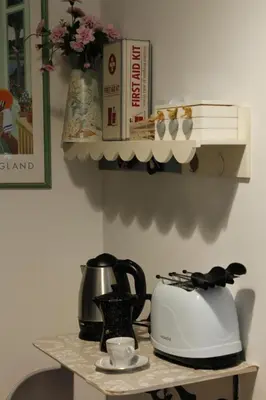 a counter with a tea kettle and a toaster on it at Alfieri home holiday in Rome