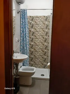 a bathroom with a toilet and a sink at OK Roma in Rome
