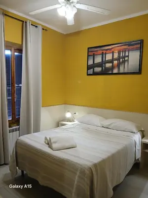 a room with a tv hanging on the wall at OK Roma in Rome