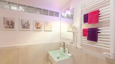 a white bathroom with a sink and a toilet at Rental in Rome Palermo apartment in Rome