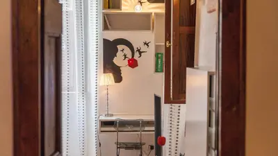 a view of a room with a table and a mirror at Rental in Rome Mial house in Rome