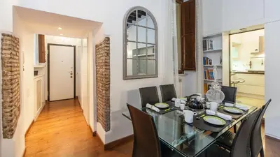 a dining room with a glass table and chairs at Rental in Rome Mial house in Rome