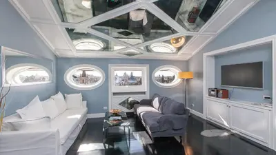 a living room with blue walls and a coffered ceiling at Rental in Rome Flaminio View Suite in Rome
