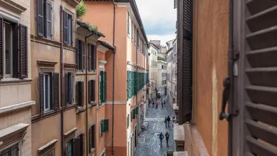 a view of an alley between two buildings at Rental in Rome Navona Loft in Rome