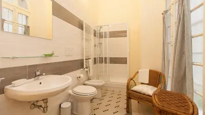 a bathroom with a sink and a toilet and a shower at Rental in Rome Ghetto Garden in Rome