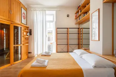 a bedroom with a large bed with towels on it at Villa Michelangelo Deluxe in Rome