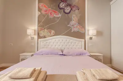 a bedroom with a bed with two towels on it at Boschetto 124 Apartment in Rome