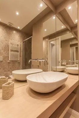 a bathroom with three sinks and a large mirror at Boschetto 124 Apartment in Rome