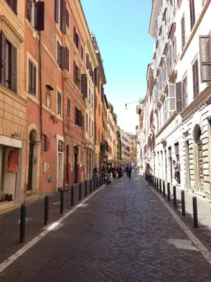 a cobblestone street in a city with buildings at Boschetto 124 Apartment in Rome