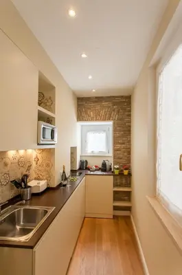 a kitchen with a sink and a counter at Boschetto 124 Apartment in Rome
