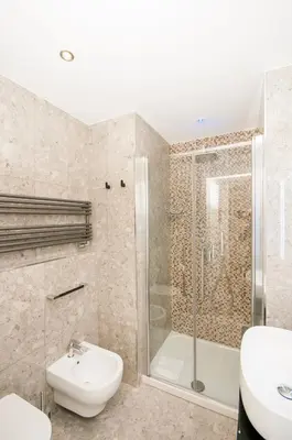 a bathroom with a shower and a toilet and a sink at Vatican Relais Rome in Rome