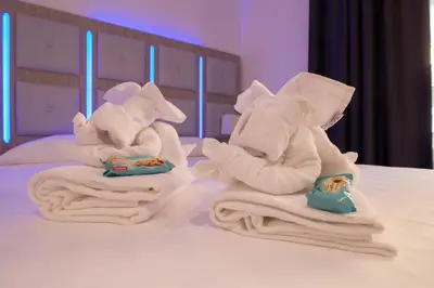 a couple of towels and towels on a bed at Vatican Relais Rome in Rome
