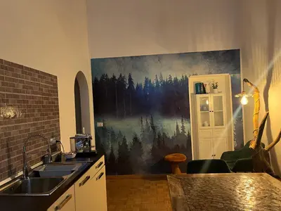 a kitchen with a sink and a painting on the wall at Apartment Rome 18 in Rome