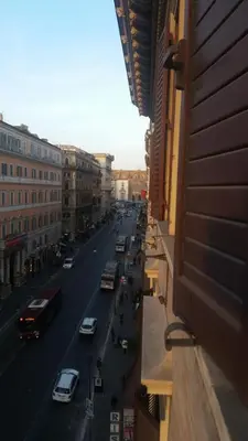a view of a city street with cars and buses at Apartment Rome 18 in Rome