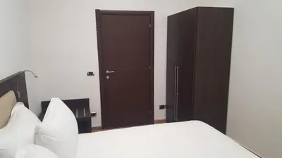 a bedroom with a bed and a mirror at Una Finestra su Monti in Rome