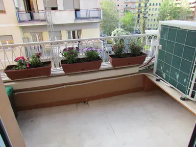 a balcony with potted plants on a ledge at Latere Vatican Loft in Rome